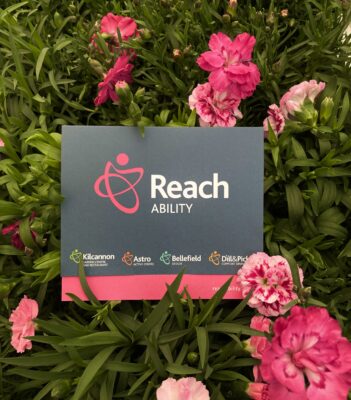 Reach Ability Gift Voucher on a bew of carnations
